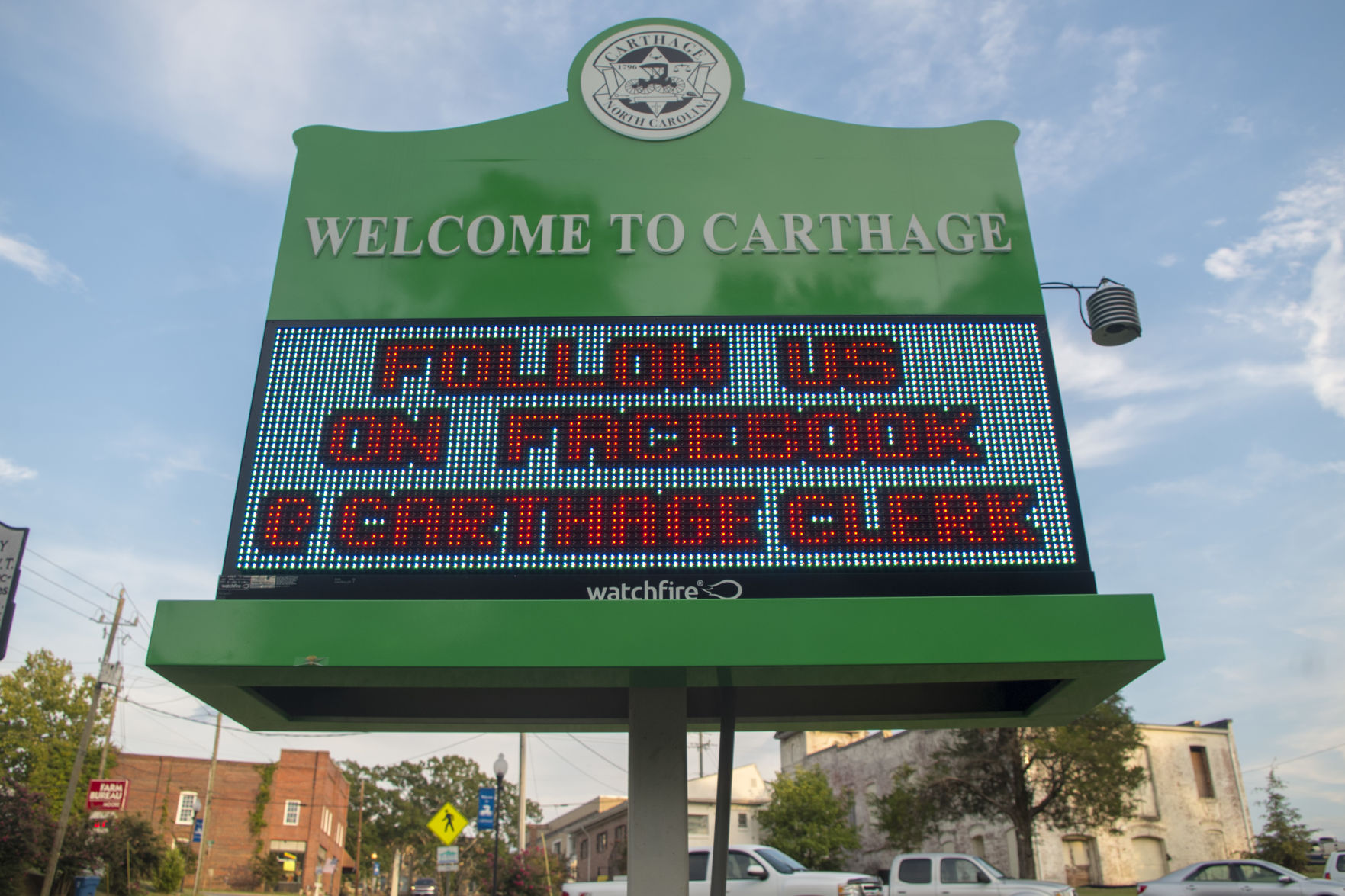 An LED sign promoting Carthage's Facebook page in front of the McDonald Building.